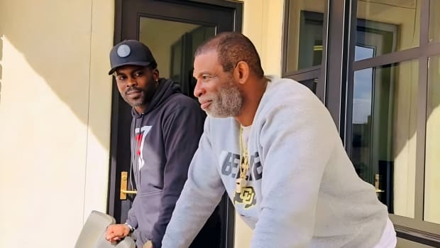 Deion Sanders and Michael Vick take in the view at Folsom Field